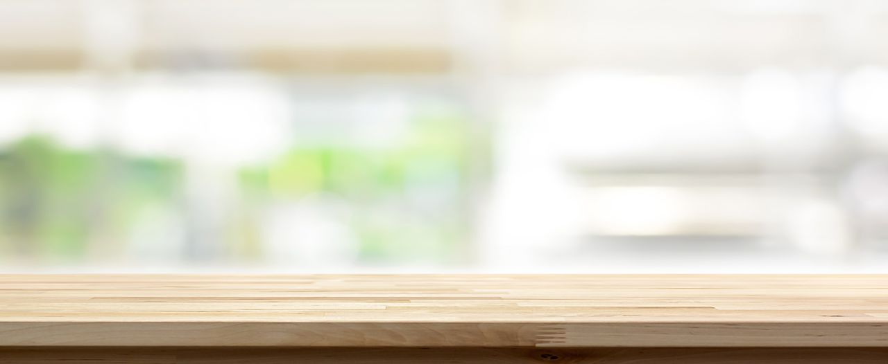 Wood table top on blur kitchen window background